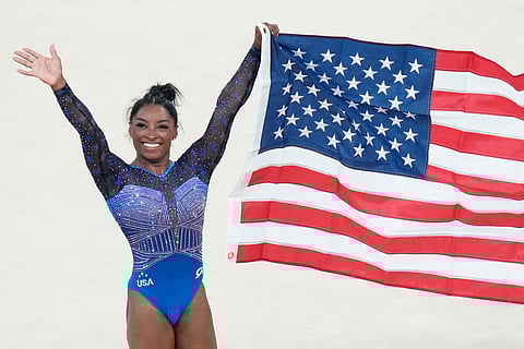 Simone Biles celebrates after winning the gold medal during the women's artistic gymnastics all-around finals (Photo | AP)