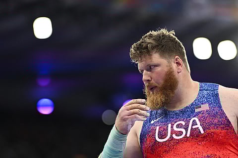 US' Ryan Crouser competes in the men's shot put final of the athletics event at the Paris 2024 Olympic Games at Stade de France in Saint-Denis, north of Paris, on August 3, 2024.
