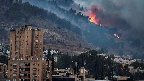 Hezbollah fires rockets, Israel strikes after attack kills Lebanon rescuers