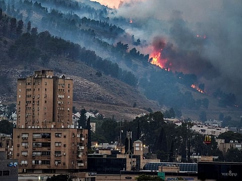 Ambulances are surrounded by people at the entrance of the American University of Beirut Medical Center, on September 17, 2024, after explosions hit locations in several Hezbollah strongholds around Lebanon amid ongoing cross-border tensions between Israel and Hezbollah fighters.