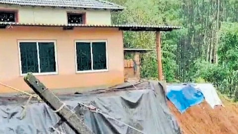 A landslip close to a house 
at Gudde Thota in Koppa taluk  
