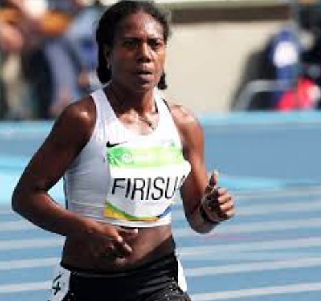Sharon Firisua of the Solomon Islands, competes in the women's 100 meter run at the 2024 Summer Olympics, Friday, August 2, 2024, in Saint Denis, France.