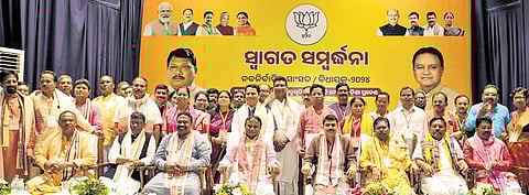 CM Mohan Charan Majhi poses for a group photo with the newly-elected tribal MLAs and MPs of BJP at Jayadev Bhavan in Bhubaneswar, on Sunday