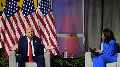 Republican presidential candidate Donald Trump left, participates in a discussion at the National Association of Black Journalists Convention and Career Fair in Chicago, Wednesday, July 31, 2024