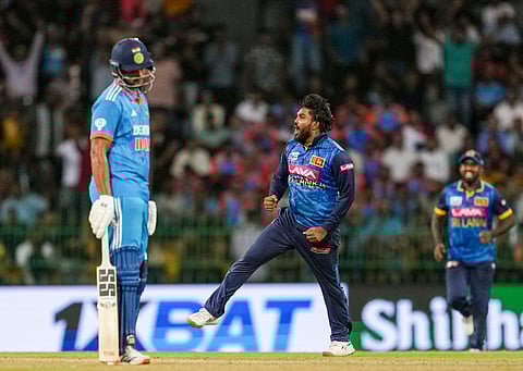 Sri Lanka's Wanindu Hasaranga celebrates the wicket of India's Kuldeep Yadav during the first ODI cricket match of the series between India and Sri Lanka, at R Premadasa International Stadium, in Colombo, Friday, Aug. 2, 2024.