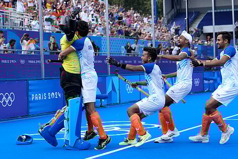 Indian players celebrate after the shoot-out win over Great Britain