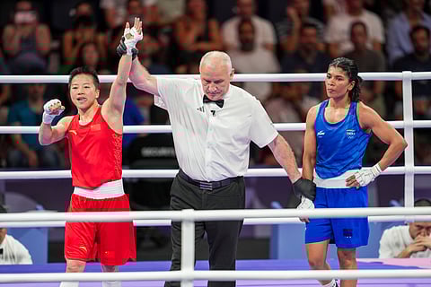 China's Wu Yu (in red) being declared winner in the women�s 50kg Round of 16 boxing match against India's Nikhat Zareen at the 2024 Summer Olympics