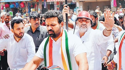 DCM DK Shivakumar takes part in a bike rally as part of Janandolana in Channapatna on Sunday