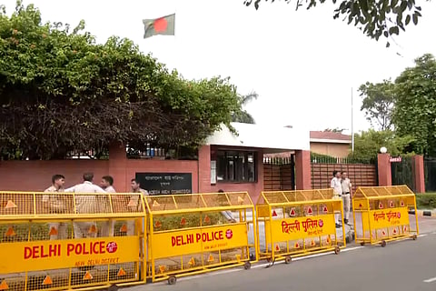 Delhi Police setting up barricades  outside the Bangladesh High Commission