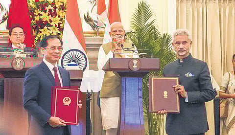 EAM S Jaishankar and Vietnam’s Foreign Affairs Minister Bui Thanh Son exchange documents during a joint press statement at Hyderabad House in New Delhi.