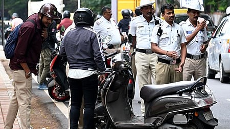 Traffic police stopped the vehicle riders who were breaking traffic rules and fined them in Bengaluru