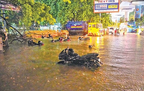 Vehicles, police barricades submerged after Wednesday's rains.
