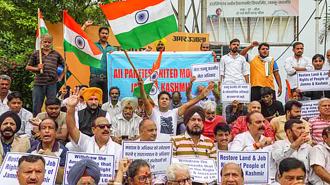 All Party United Morcha supporters protest demanding restoration of statehood of Jammu and Kashmir, in Jammu.