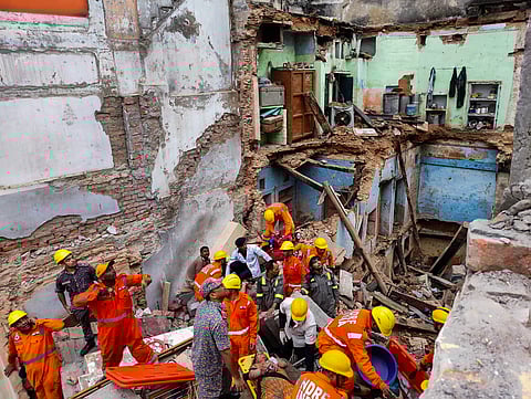 Varanasi: NDRF personnel conduct a rescue operation after two dilapidated houses collapse near the Kashi Vishwanath temple, in Varanasi on Tuesday. One person died and eight rescued in the incident.