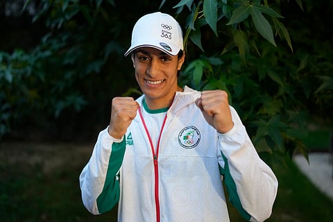 Algerian boxer Imane Khelif poses for a photo after an interview with SNTV at the 2024 Summer Olympics, Sunday, Aug. 4, 2024, in Paris, France.