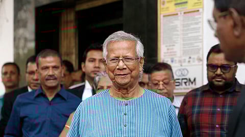 Bangladeshi Nobel peace laureate Muhammad Yunus (C) prepares to leave after filing an appeal for the extension of his bail at Labour Appellate Tribunal in Dhaka on March 3, 2024.