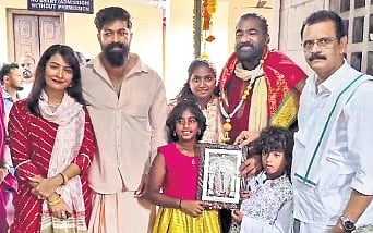 Yash, Radhika Pandit visit Dharmasthala with producer Venkat Narayan and family