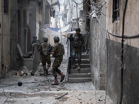 Rachel Goldberg, left, and Jon Polin center, parents of Israeli-American hostage Hersh Goldberg-Polin, along with other relatives of hostages held in the Gaza Strip by the Hamas militant group take part in a protest calling for their release in the Kibbutz Nirim, southern Israel.