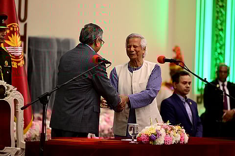 Nobel laureate Muhammad Yunus (C) is sworn in as the chief adviser of the new interim government of Bangladesh in Dhaka on August 8, 2024, as President Mohammed Shahabuddin (2L) administers the oath taking ceremony.