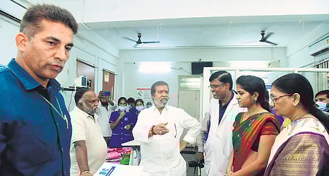 Health Minister Damodar Rajanarasimha speaks to the staff of the Government 
Medical College 