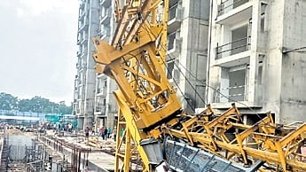 The mangled tower crane at the mishap site in SCB Medical College and Hospital