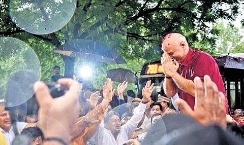 Former deputy chief minister Manish Sisodia greeting AAP workers outside Tihar Jail after his release on bail on Friday.