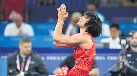 India's Vinesh Phogat celebrates after winning her Women's Freestyle 50kg semi-final wrestling match against Cuba's Yusneylys Guzman Lopez at the 2024 Summer Olympics, in Paris, France, Tuesday, Aug. 6, 2024.