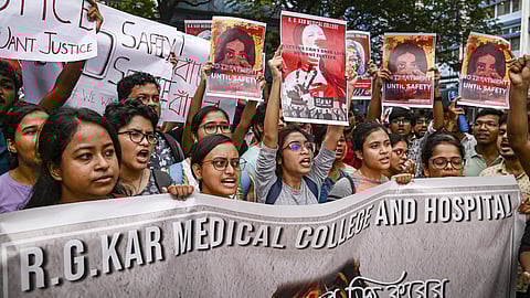 Junior doctors protest against the rape and killing of a trainee doctor, at RG Kar Medical College and Hospital in Kolkata.