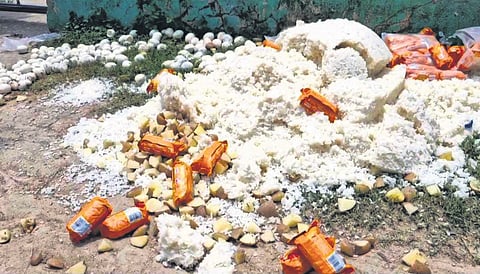 Cooked rice, boiled eggs and potatoes thrown outside the school boundary 