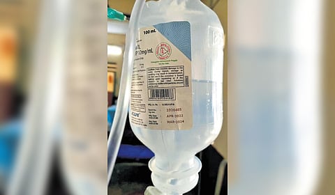 The bottle of expired saline administered to a patient in Khanapur Government Hospital 