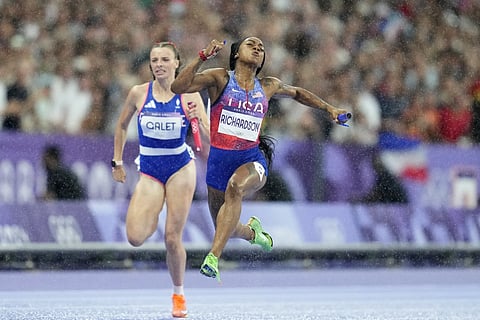 Sha’Carri Richardson, of the United States, crosses the finish line to win the women's 4x100 meters relay final at the 2024 Summer Olympics, Friday, August 9, 2024.