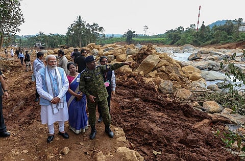 Prime Minister Narendra Modi interacts with officials during an inspection of the landslide-hit areas, in Wayanad district, Saturday, Aug. 10, 2024. 
