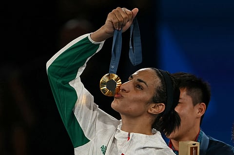 Gold medallist Algeria's Imane Khelif poses on the podium during the medal ceremony for the women's 66kg final boxing category during the Paris 2024 Olympic Games.