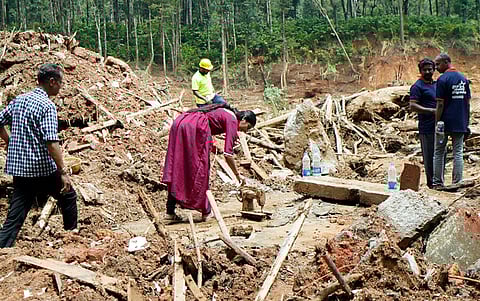 A landslide victim spotting her sewing machine during the mass search.