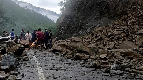 Debris being cleared from a highway following a landslide, in Uttarakhand's Chamoli district