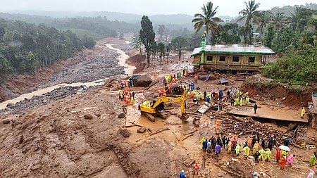 An infant being rescued by the National Disaster Relief Force team from the landslide-affected Mundakkai in Wayanad.