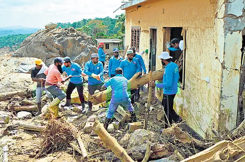 Volunteers conduct mass search operation in a landslide-hit area in Wayanad on Sunday 