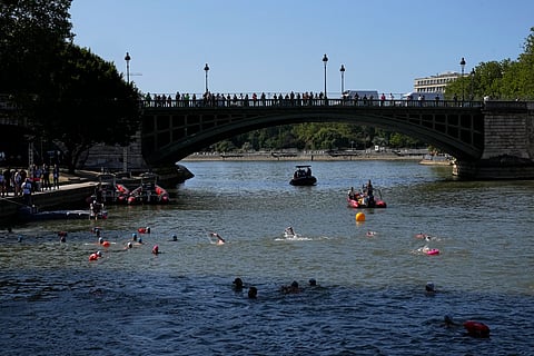 People swim in the Seine river after Paris Mayor Anne Hidalgo swam in the river.