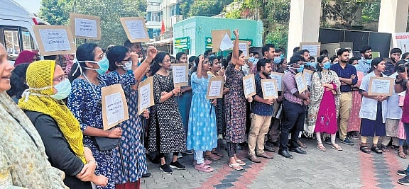 Medicos protesting at Govt Medical College in Thiruvananthapuram on Monday