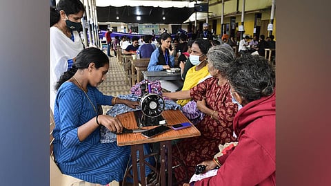Shruthi M and Remya Manoj doing alteration works for the
survivors's dress.