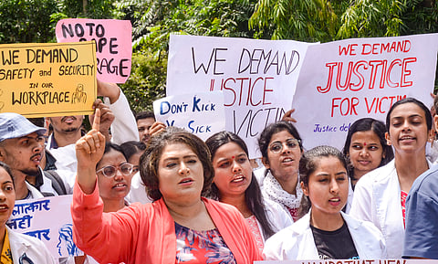 Junior doctors of Rajendra Institute of Medical Sciences (RIMS) stage a protest against the sexual assault and murder of a postgraduate trainee doctor in Kolkata, in Ranchi, Tuesday, Aug. 13, 2024.