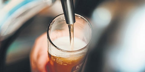 The crisp pop of the bottle and the rising froth invite camaraderie, relaxation, and laughter among friends.