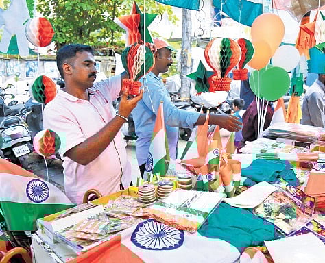 Shopkeepers selling flags and decorations for Independence day.