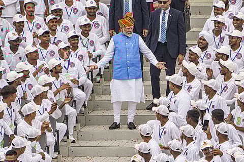 Prime Minister Narendra Modi greets children at the Red Fort on 78th Independence Day, in New Delhi, Thursday, Aug. 15, 2024. 