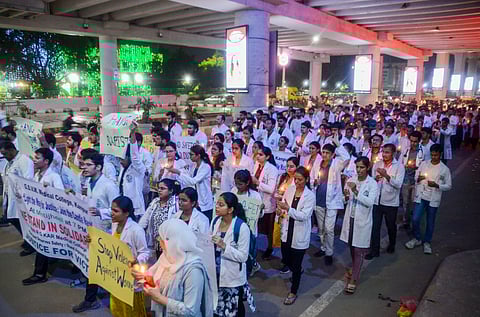 Junior doctors of Kanpur Medical College take part in a candle march to condemn the rape and killing of a trainee doctor at Kolkata's RG Kar Medical College, in Kanpur, Wednesday, Aug. 14, 2024.
