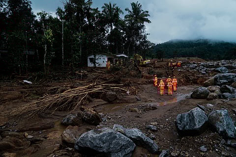 Rescuers search through mud and debris for a third day after landslides set off by torrential rains in Wayanad district, Kerala state, India, Thursday, Aug. 1, 2024.