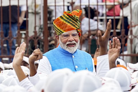 Prime Minister Narendra Modi greets children at the Red Fort on 78th Independence Day, in New Delhi, Thursday, Aug. 15, 2024. 