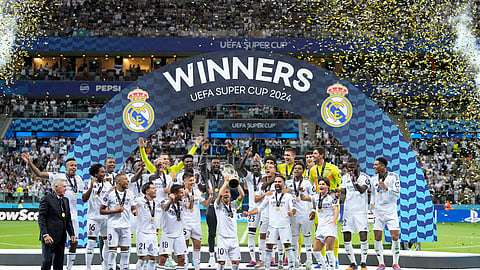 Real Madrid's Luka Modric lifts the trophy after winning the UEFA Super Cup Final soccer match between Real Madrid and Atalanta at the Narodowy stadium in Warsaw, Poland,on August 14, 2024.