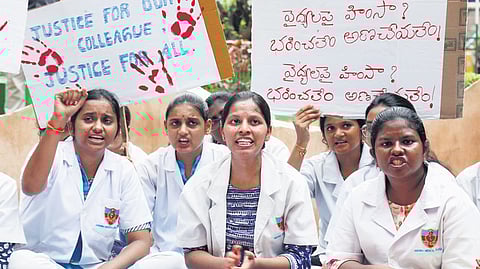 APJUDA members stage a protest at KGH in Vizag 