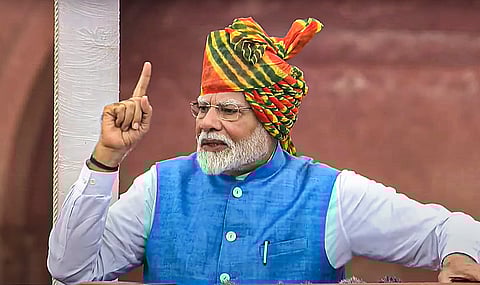 Prime Minister Narendra Modi greets children at the Red Fort on 78th Independence Day, in New Delhi, Thursday, Aug. 15, 2024. 
